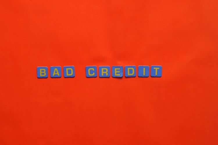 A Bad Credit Text On Red Surface