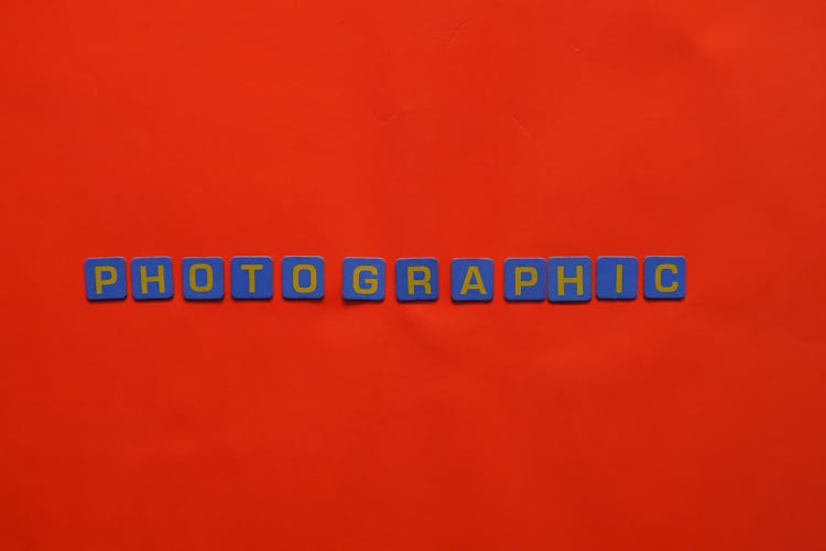 The Word Photographic With A Red Background