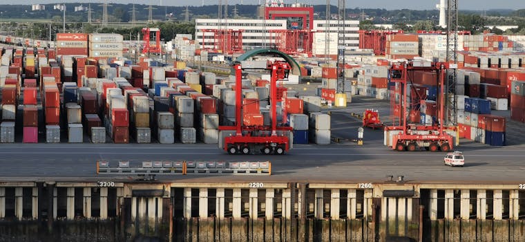 Aerial shot of cargo containers and cranes at Bremerhaven port, Germany.