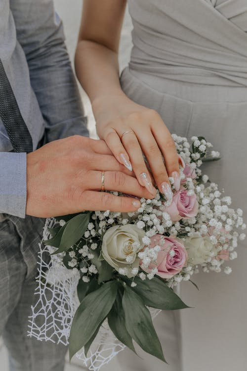 Free Close-up Photo of Bride and Groom's Hands Stock Photo