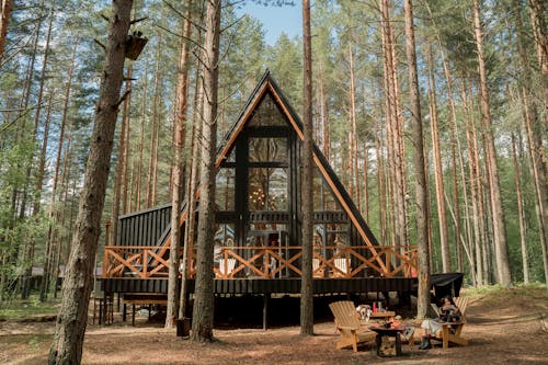 A Wooden House with Glass Wall on Camping Site