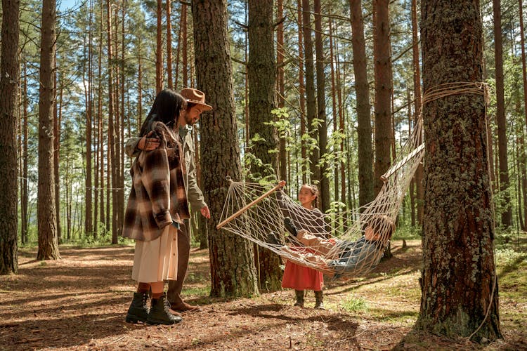 Photo Of A Family Enjoying At Camping Site