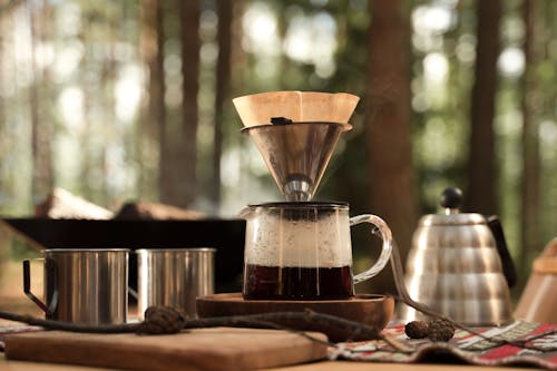 Free Sticks and Pine Cones Near a Coffee Maker Stock Photo