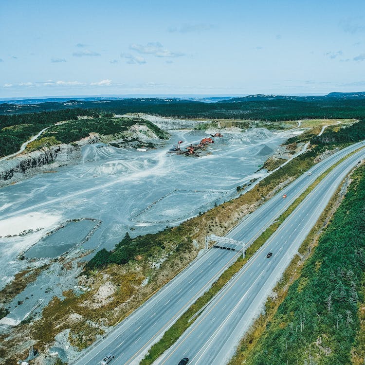 Car Driving On A Highway Near A Mine