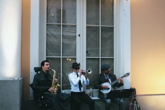 A Group of Men Playing Musical Instruments at the Street