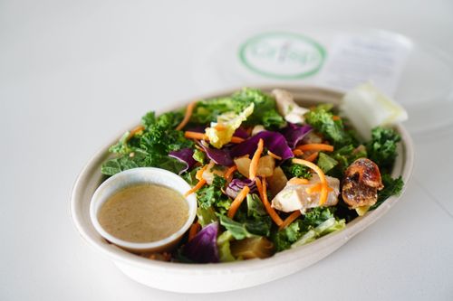 Free Healthy vegetable salad with diverse ingredients in a white oval container. Stock Photo