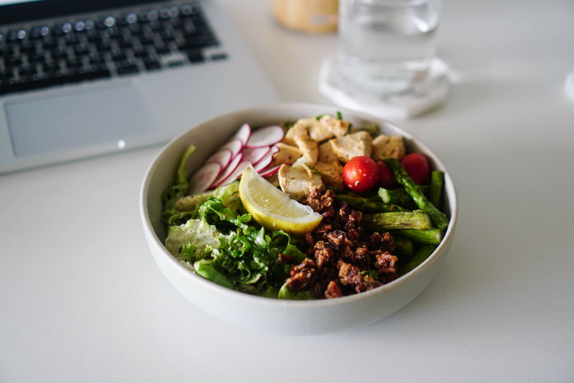 Delicious Dairy-Free Broccoli Salad You’ll Love Delicious salad bowl with a variety of fresh vegetables, tofu, and a lemon slice, perfect for a nutritious meal.