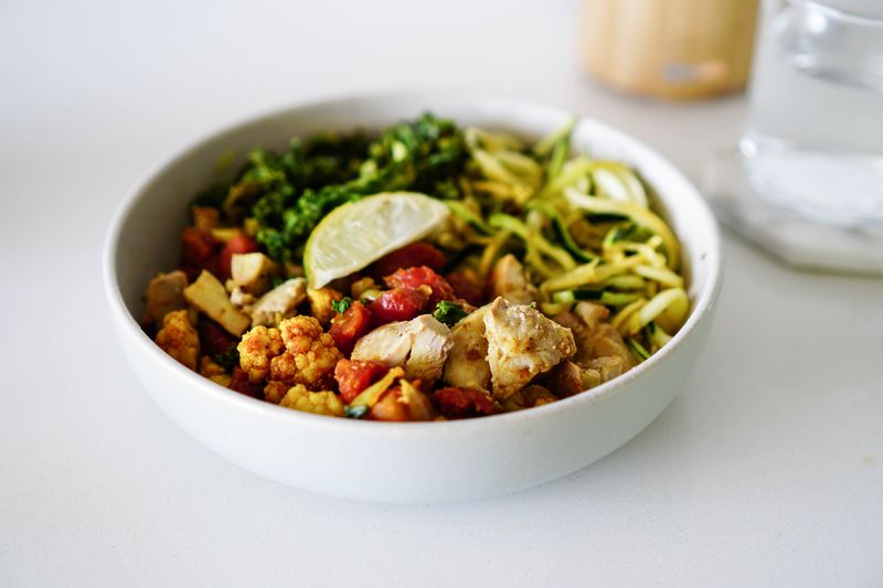 Chicken and grain bowl with roasted vegetables — photo by Loren Castillo on Pexels