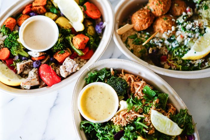 Roasted vegetable and grain bowls on a marble counter
