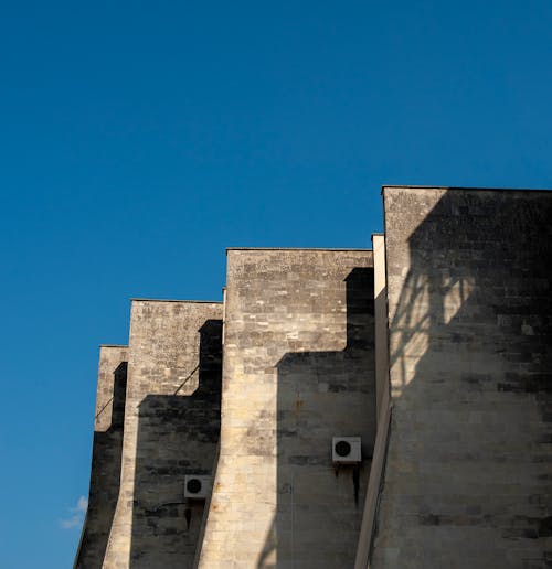 Solid Concrete Walls Under Blue Sky