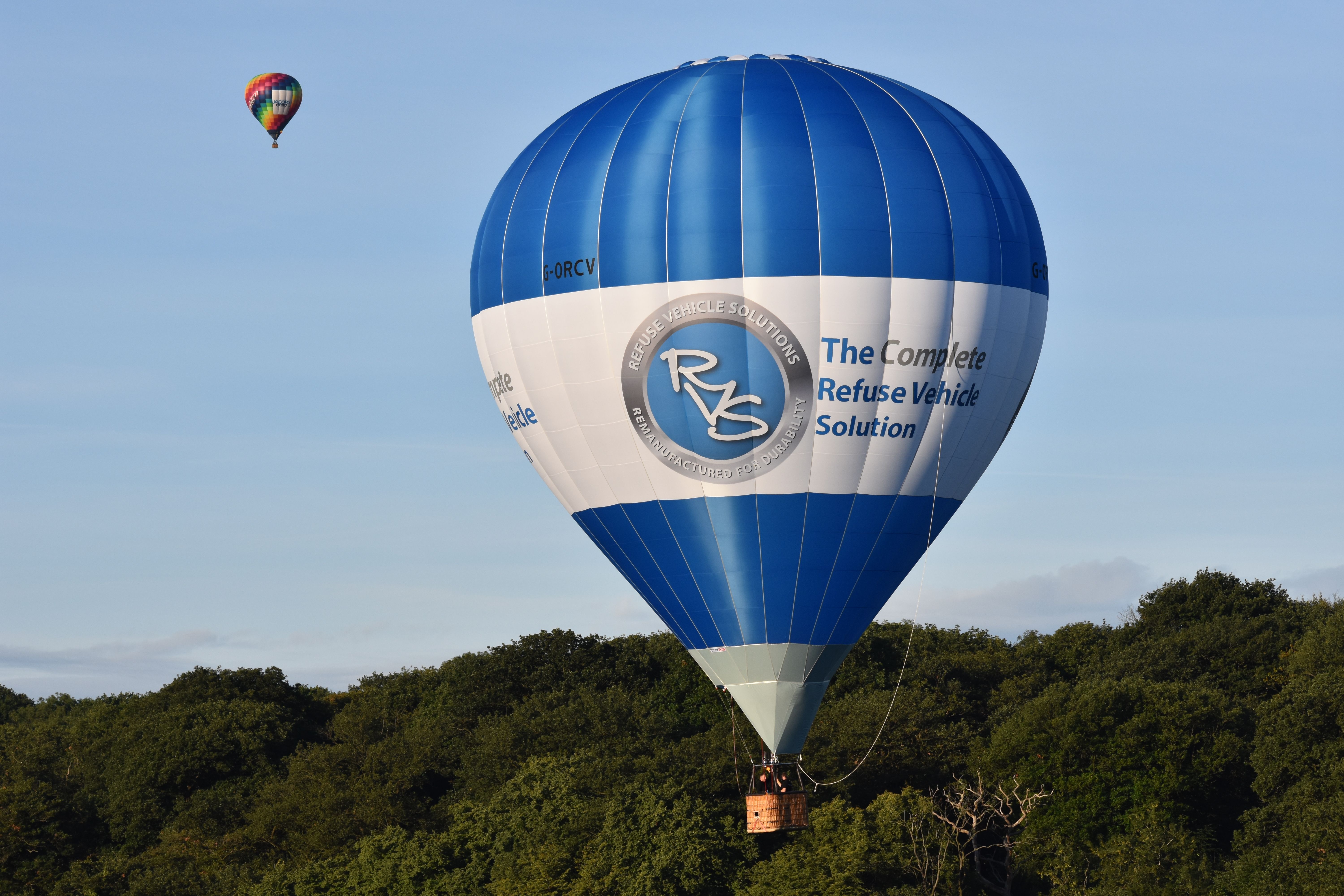 Blue and White Hot Air Balloon Flying · Free Stock Photo