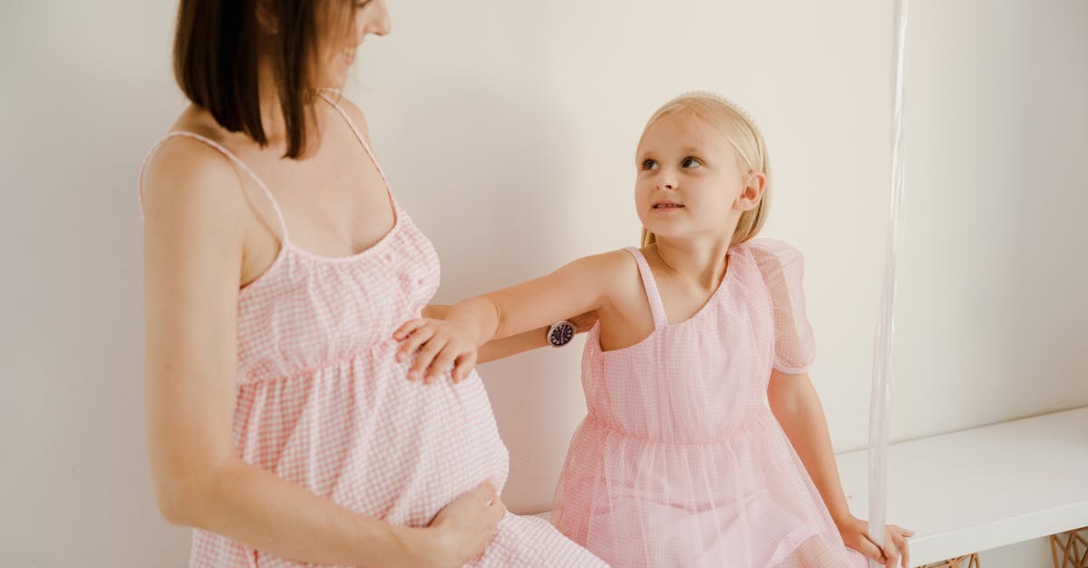 Pregnant Woman With Multiple Daughters In A Family Setting