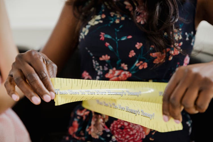 Woman Measuring Her Stomach With Plastic Measuring Tape