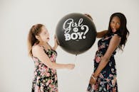 Women Holding a Balloon