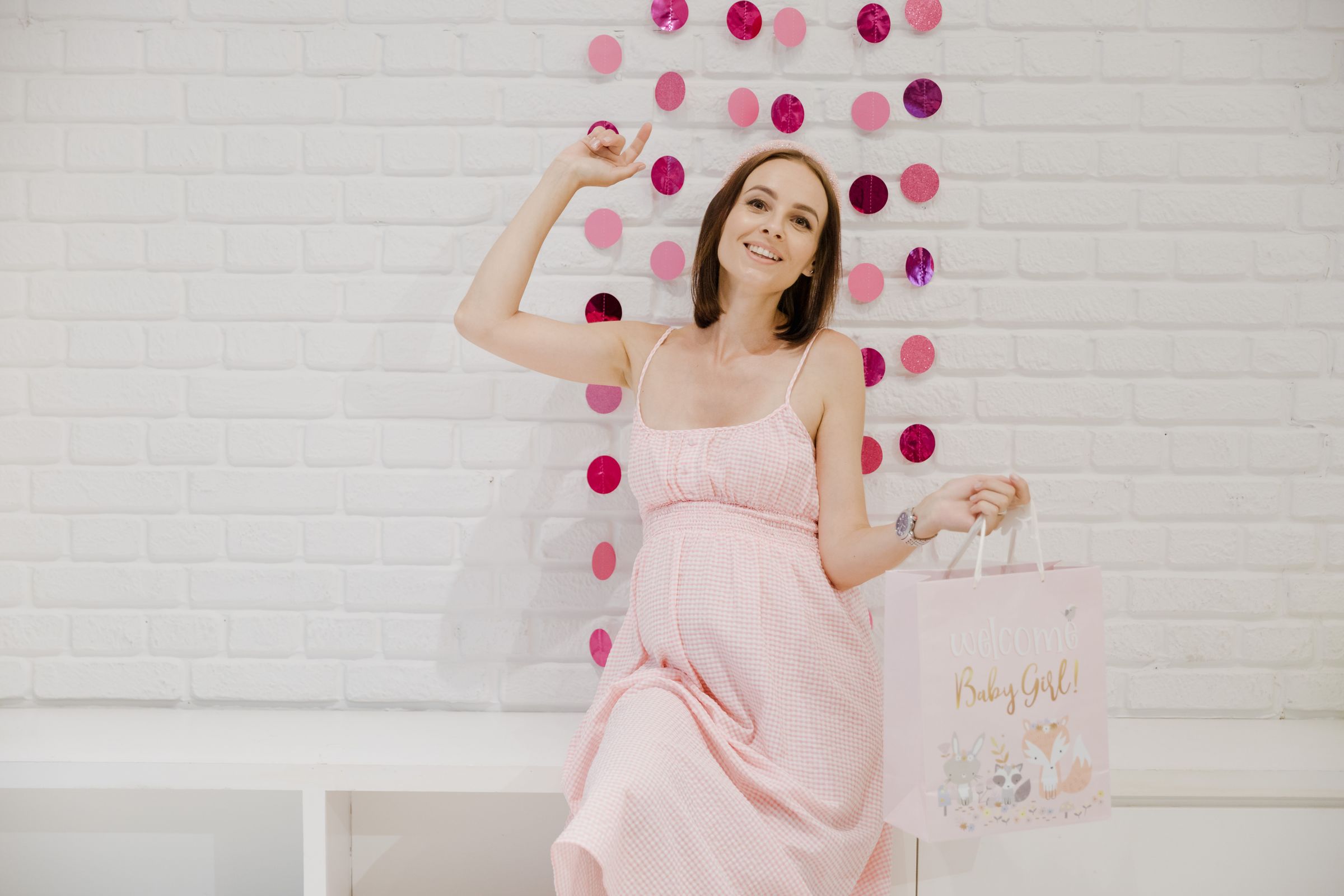 Festive baby shower celebration with pastel decorations and guests