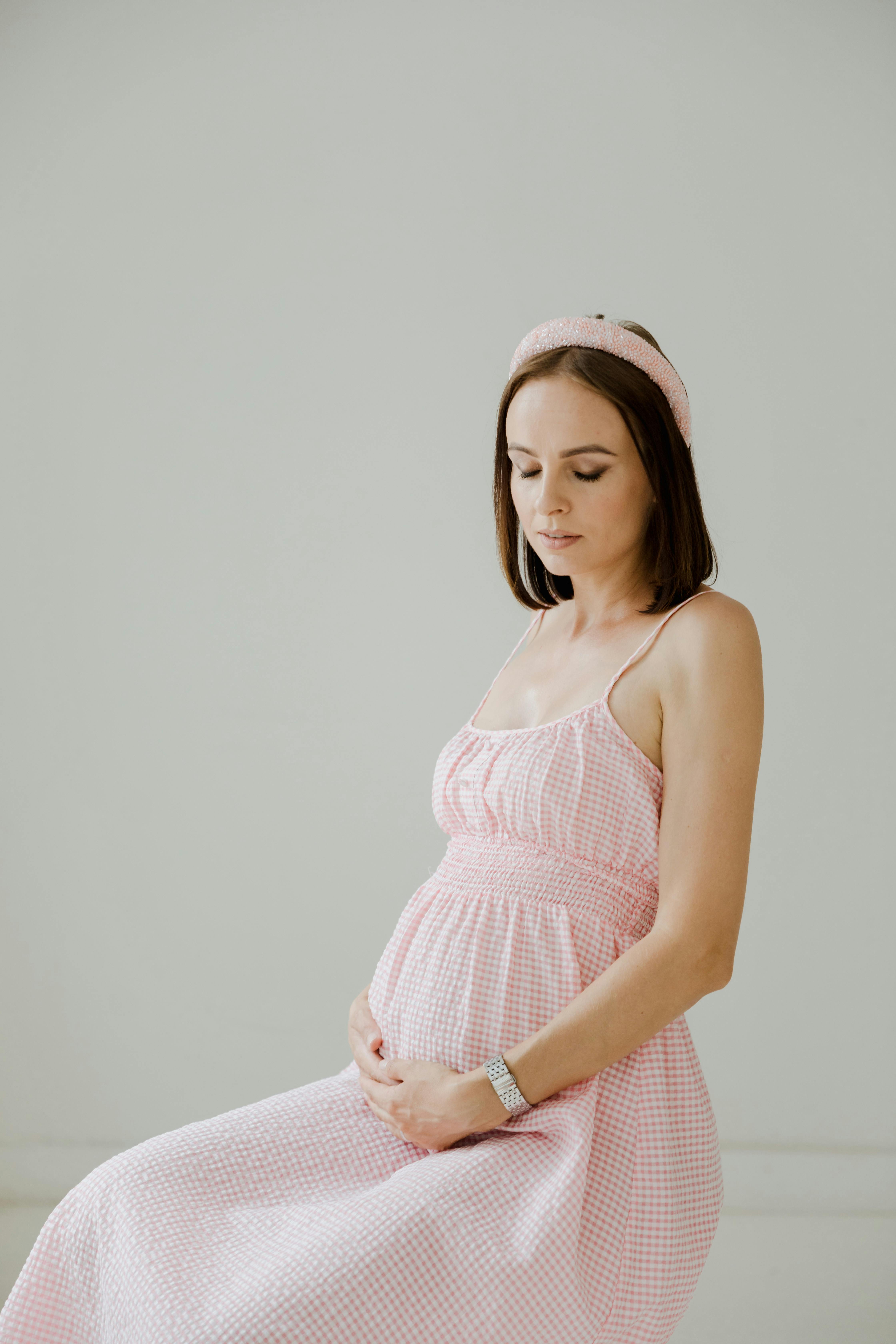 pregnant woman in pink drees