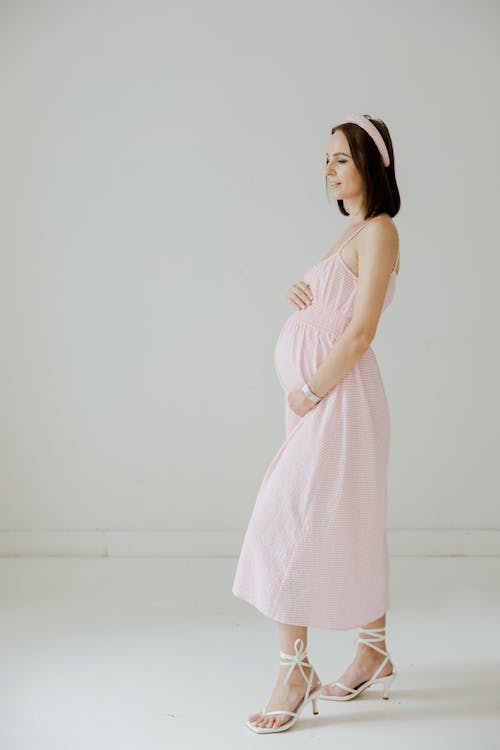 Pregnant Woman in Pink Sleeveless Dress