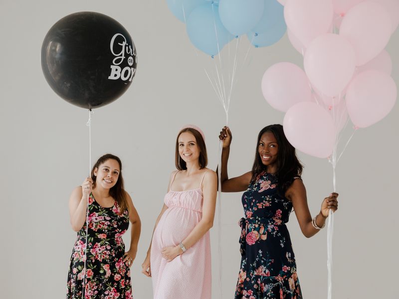 Friends celebrating with colourful balloons