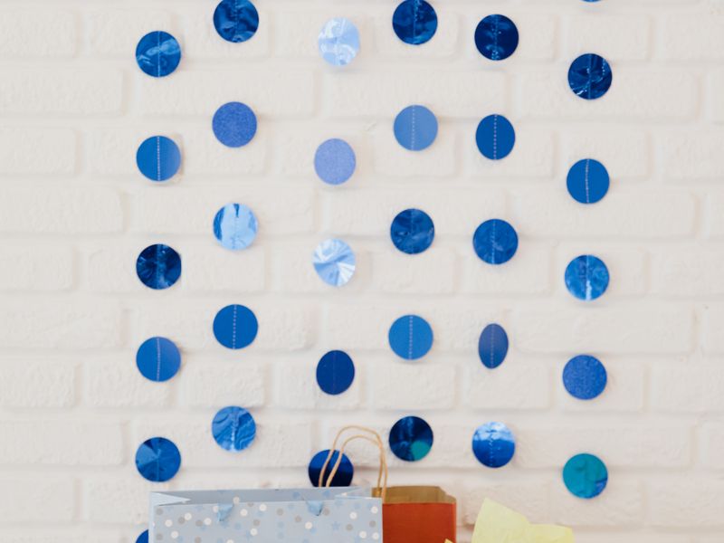 Gift bags with blue decorations at a baby shower