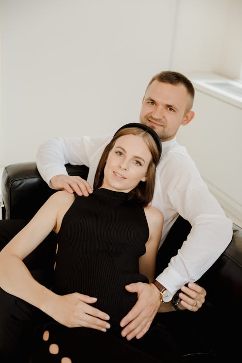 A Couple Wearing Black Dress and White Log Sleeves