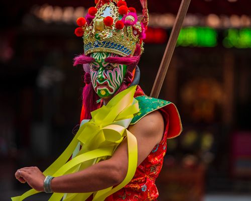 Free A vibrant cultural performer with intricate face paint and costume captured during a festival in Taiwan. Stock Photo
