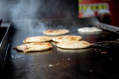 Flatbread sizzling on a hot street griddle — photo by Noé Villalta Photography on Pexels