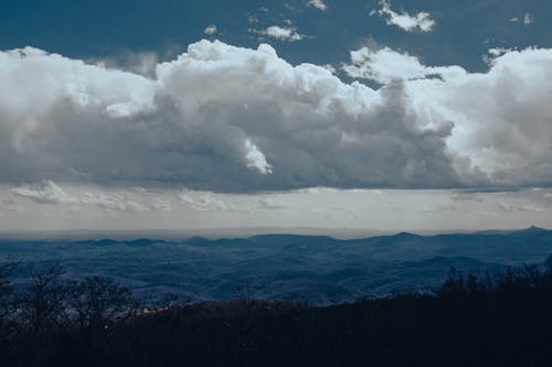 Free stock photo of blue mountains, blue sky, clouds Stock Photo