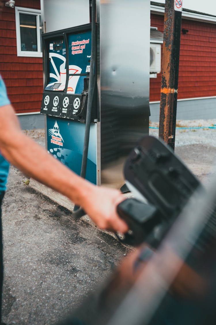 Man Pouring Gas Into Vehicle Gasoline Tank