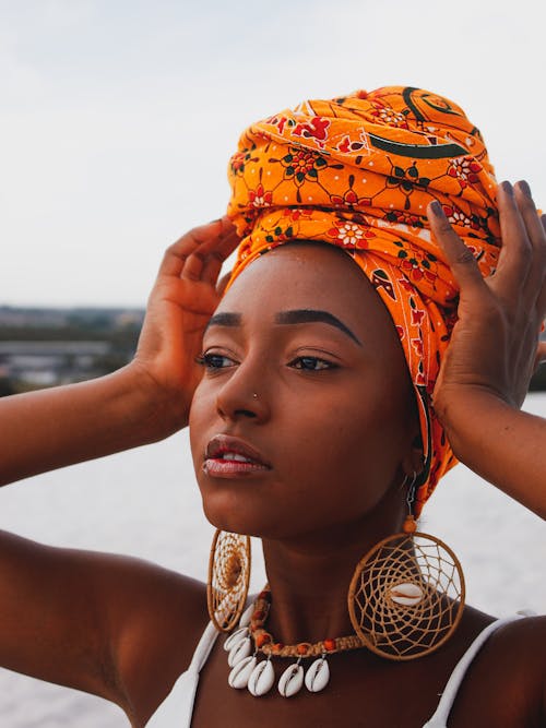 Free Close Up Photo of Woman in Orange Headscarf Stock Photo
