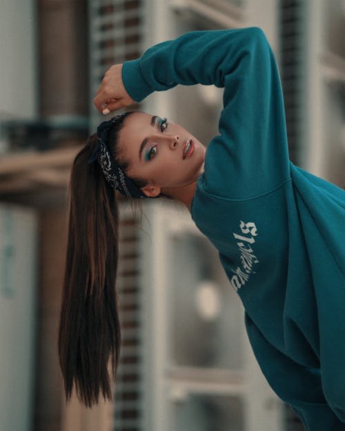 Beautiful Woman Wearing Teal Sweatshirt