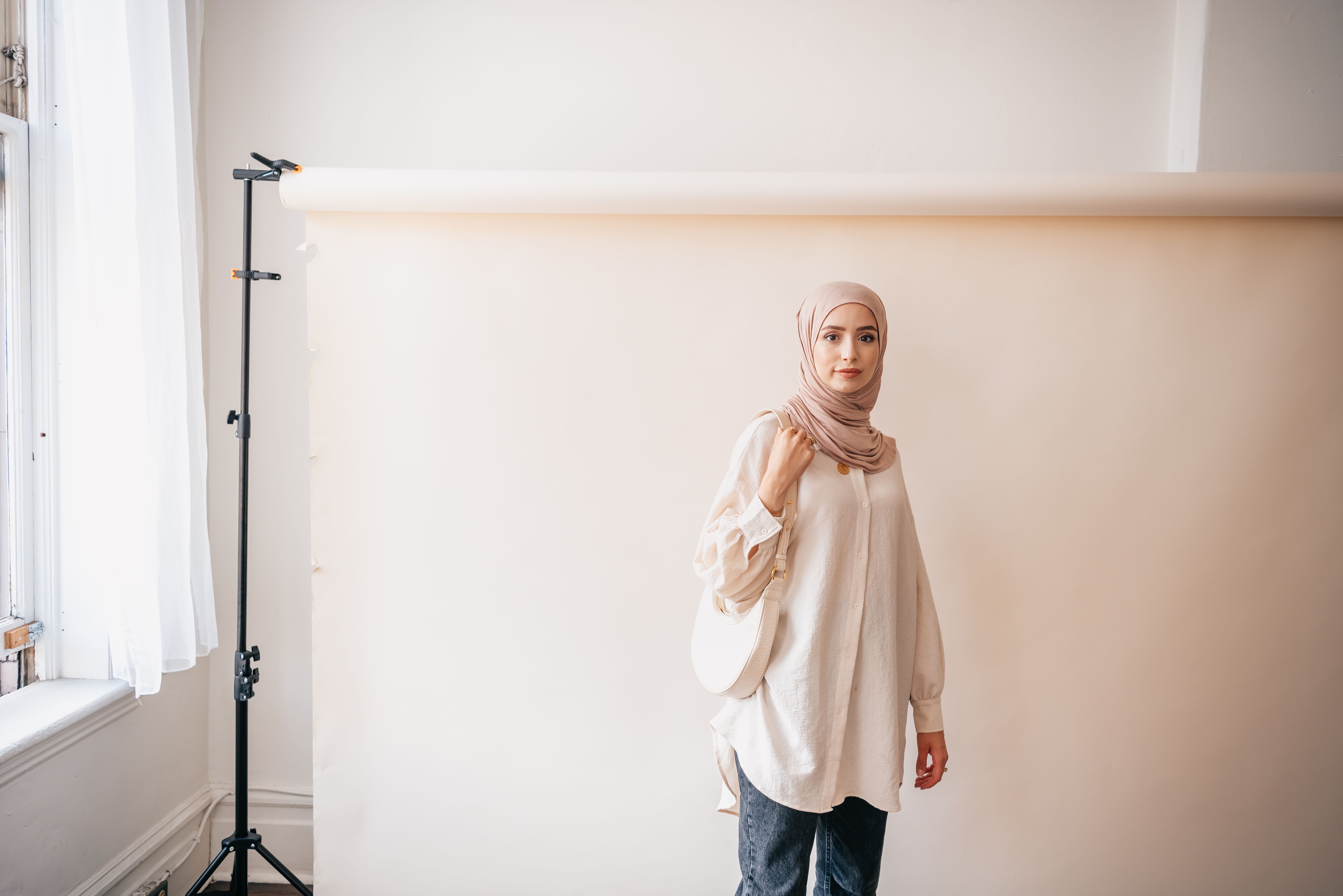 Woman in Brown Hijab Standing Beside White Wall · Free Stock Photo