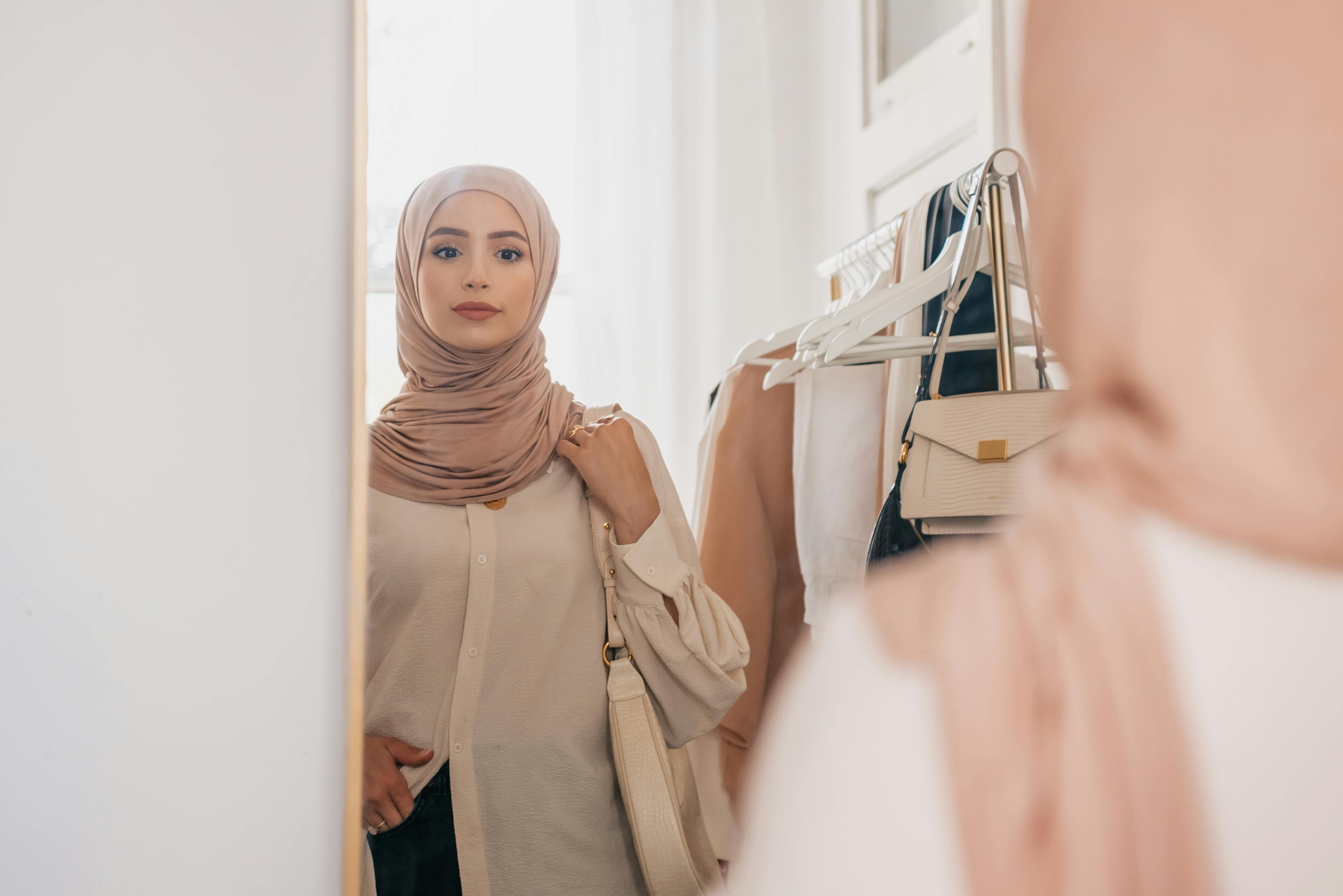 A Hijab Woman Looking at the Mirror · Free Stock Photo