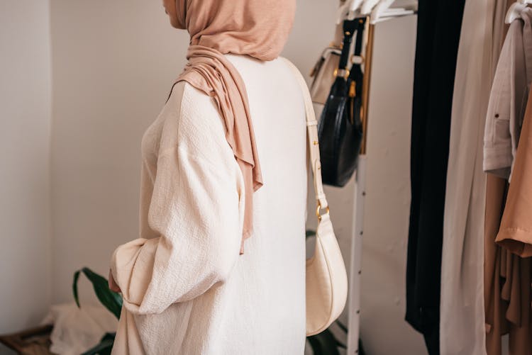 Woman In Hijab Near Wardrobe At Home