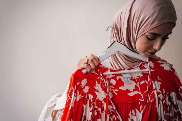 A Woman Trying On Clothes