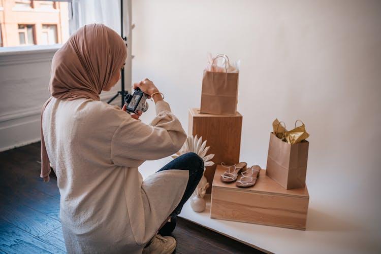 Woman Taking Photo Of Products