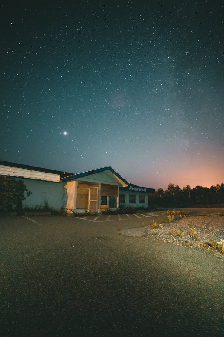 An Abandoned Building At Night