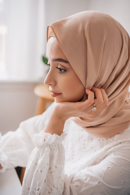 Free Woman in White Floral Dress Wearing Hijab Stock Photo