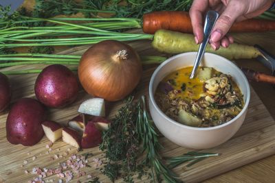 Root vegetable broth being ladled — photo by Loren Castillo on Pexels