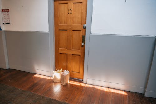 Paper Bags Left on the Doorstep of an Apartment 