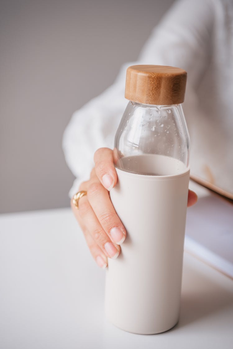 Close Up Shot Of A Person Holding A Tumbler