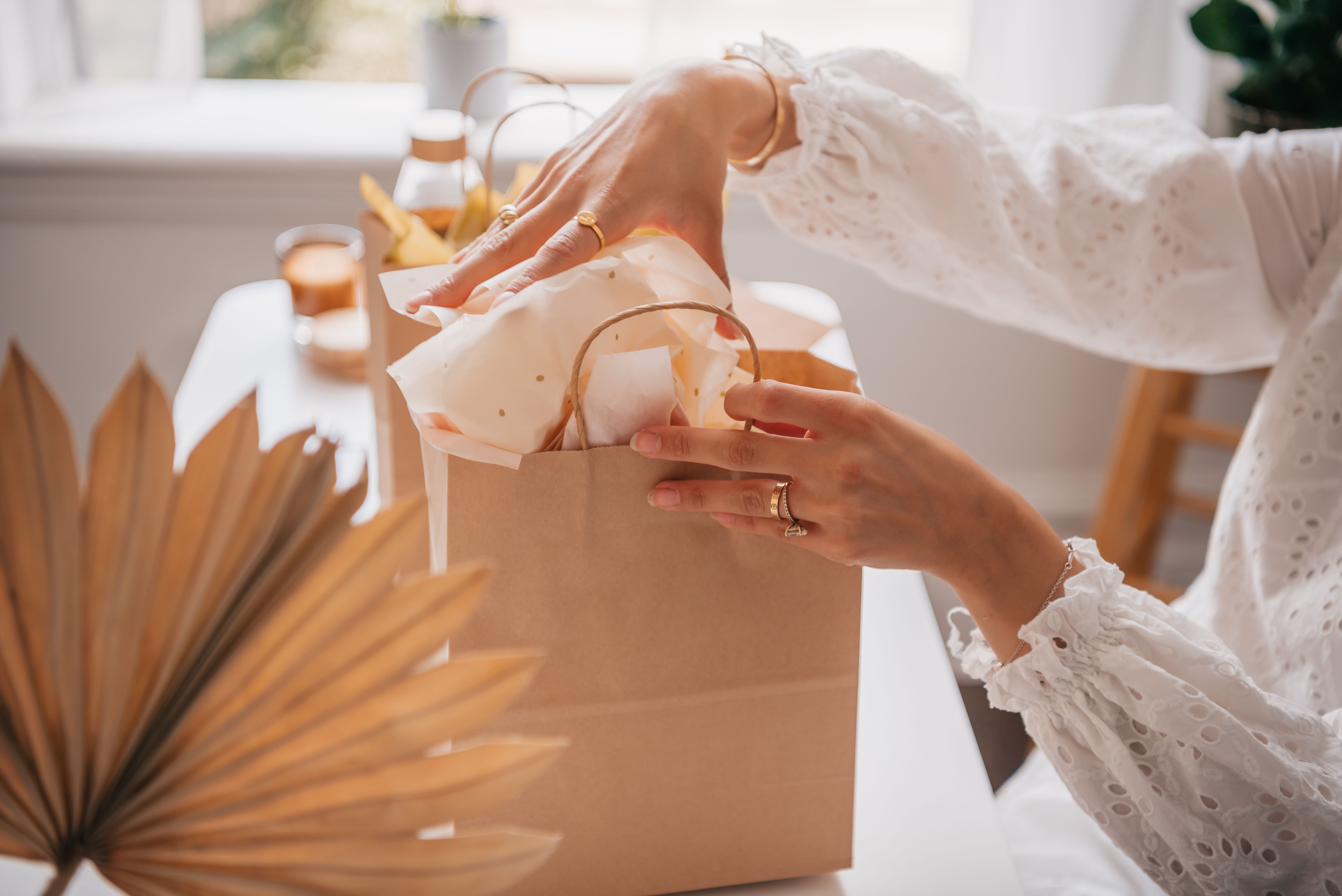 Woman in White Lace Dress Holding Brown Paper Bag  Free Stock Photo