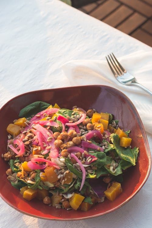 Free Vegetable Salad on Red Ceramic Bowl Stock Photo