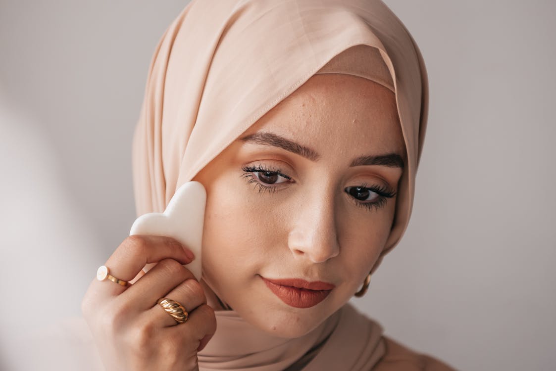 Close-up Photo of a Hijab Woman using Guache 