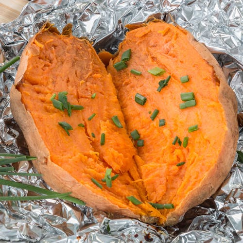 Free Cooked Sweet Potato with Chopped Chives Stock Photo