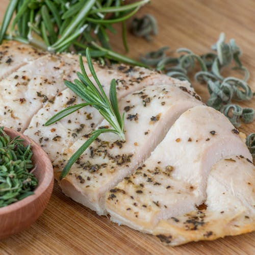 Free Cooked Chicken Breast on a Wooden Tray Stock Photo