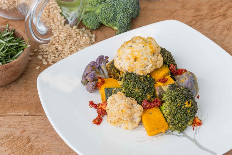 Cooked Cauliflower And Broccoli On White Plate