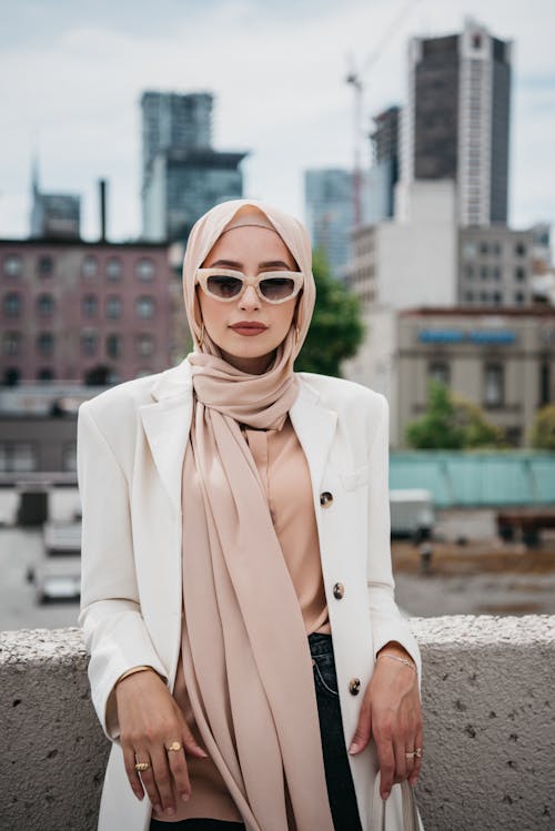 A Beautiful Woman Wearing a Hijab and Beige Coat