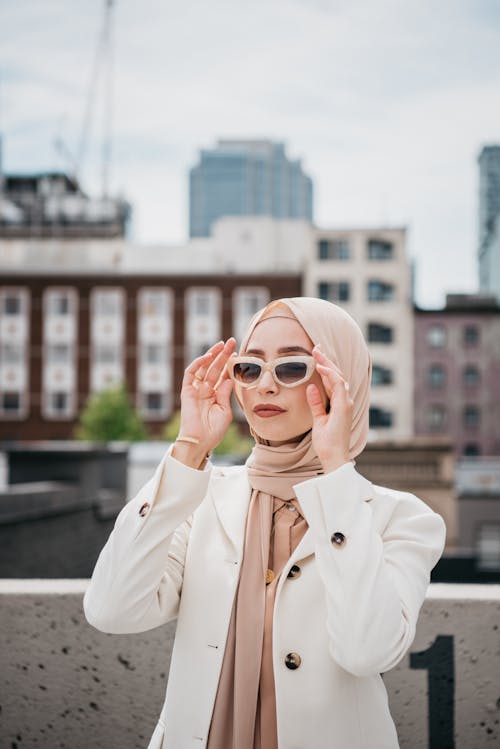 Portrait of Woman in Sunglasses and Hijab