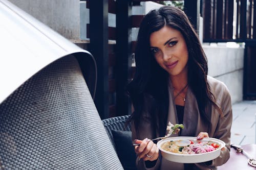 A Woman Eating Healthy Food 