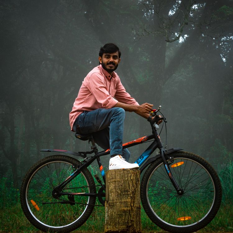 A Man Riding a Bicycle · Free Stock Photo